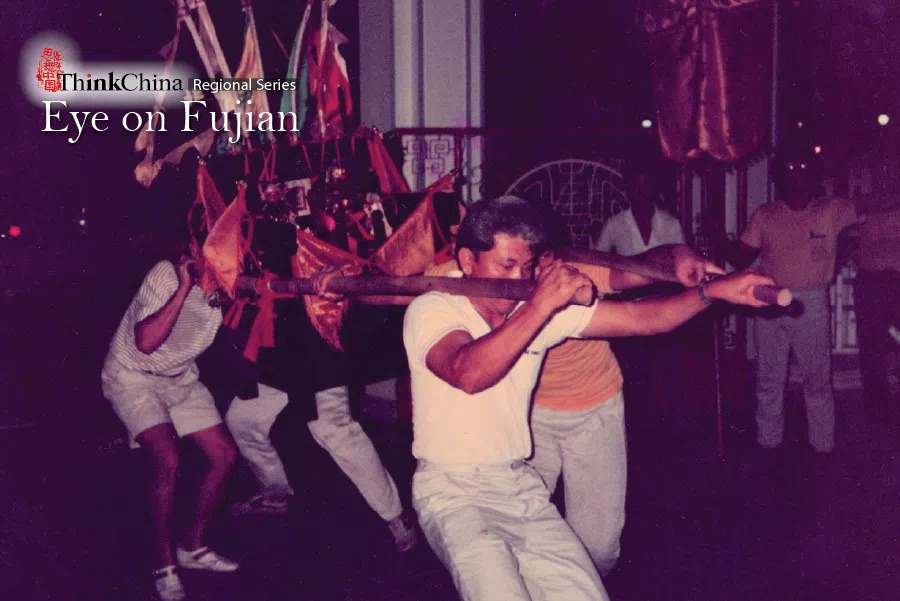 My father, Richard Hong Kuan Yin, is seen here holding one side of a sedan chair during a religious occasion, bringing a deity to Teng Yun Temple, one of only three Chinese temples officially recognised in Brunei, 13 October 1987.