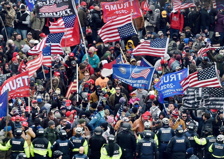 In this file photo taken on 6 January 2021, supporters of US President Donald Trump clash with police and security forces as they storm the US Capitol in Washington, DC, US. (Olivier Douliery/AFP)