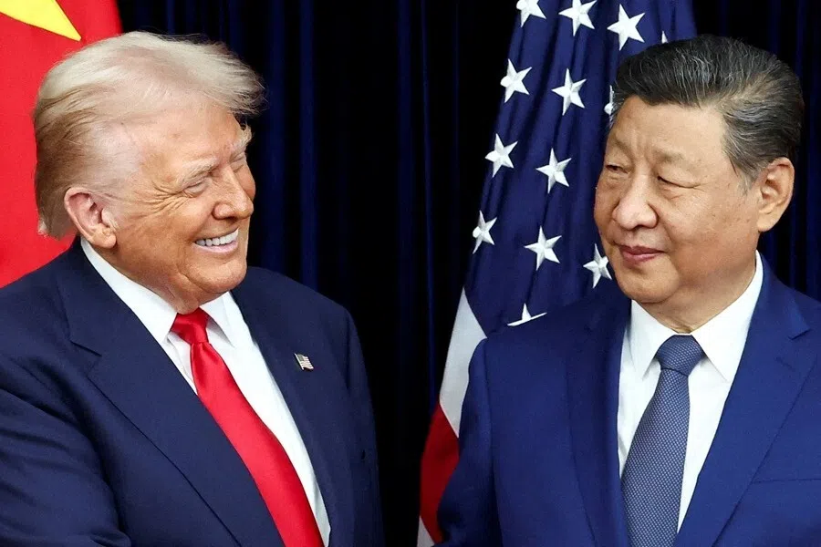 US President Donald Trump and Chinese President Xi Jinping react as they hold a bilateral meeting at Gimhae International Airport, on the sidelines of the Asia-Pacific Economic Cooperation (APEC) summit, in Busan, South Korea, 30 October 2025.