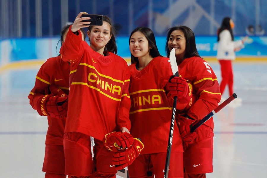 China's women's ice hockey team takes a picture during a team photo session, in Beijing, China, on 2 February 2022. (Jonathan Ernst/Reuters)