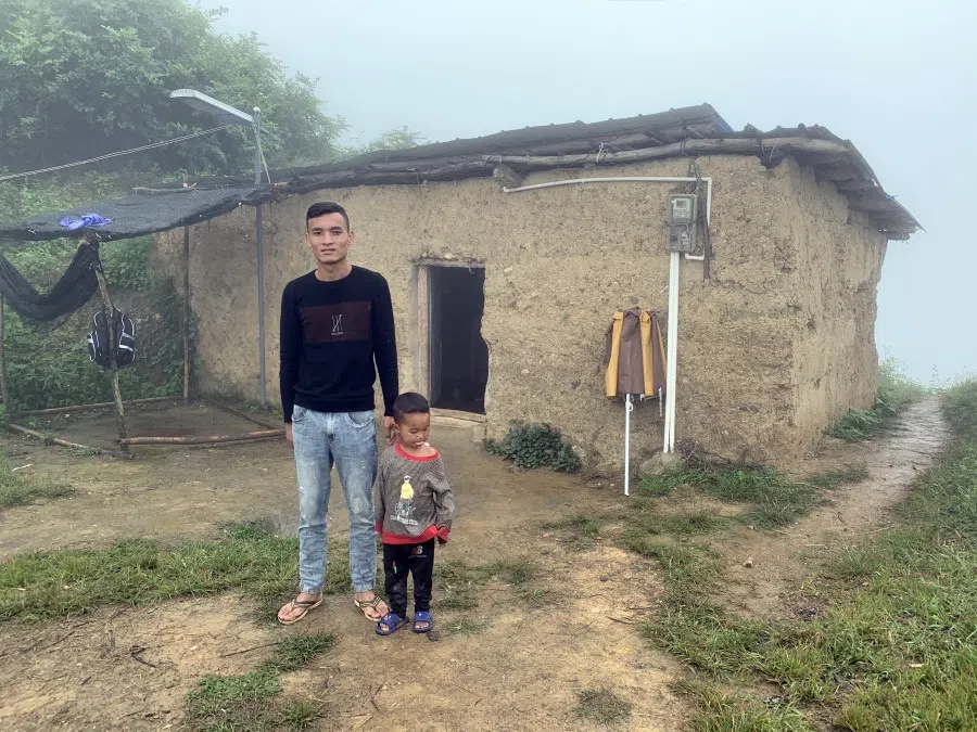 Villagers outside their home in Atulie'er, known as China's cliff village. Located on a cliff in Sichuan's Liangshan prefecture with no road to the top, it is one of the most inaccessible villages in the country. (SPH Media)