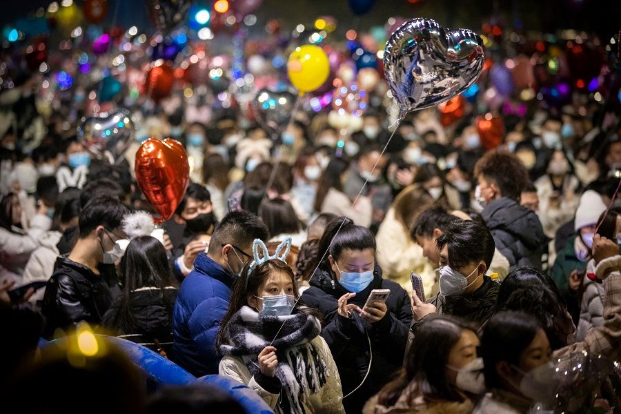This photo taken on 31 December 2022 shows people attending a New Year celebration in Wuhan, Hubei province, China. (AFP)