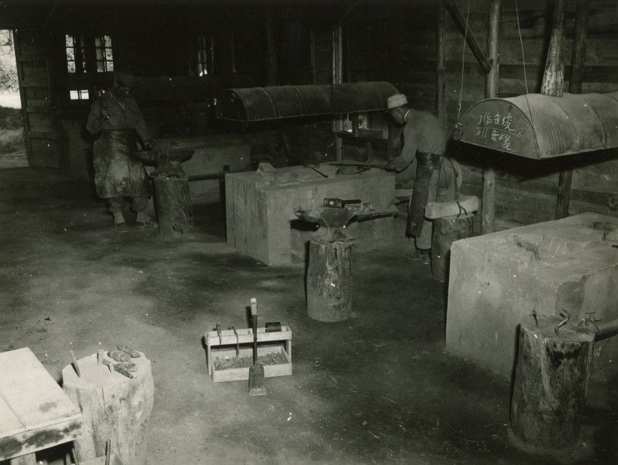 Workers making horseshoes.