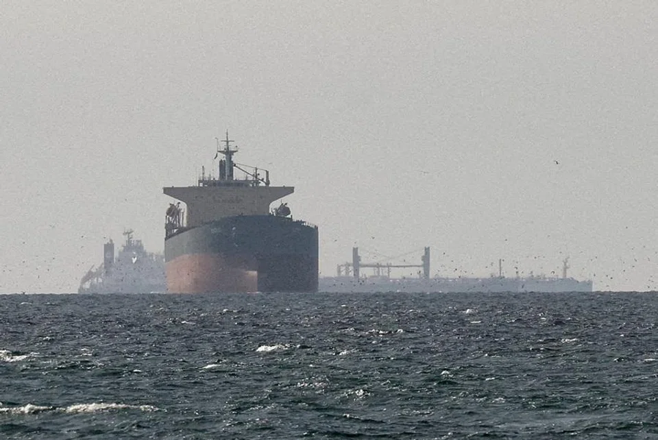 Cargo ships in the Gulf, near the Strait of Hormuz, as seen from northern Ras al-Khaimah, near the border with Oman’s Musandam governance, amid the US-Israeli conflict with Iran, in United Arab Emirates, on 11 March 2026. (Reuters)