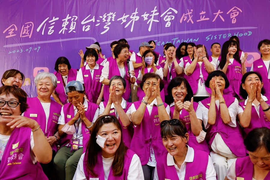 The all-female volunteer group of Taiwan's Vice President William Lai takes a group photo at an event in Taipei, Taiwan, 9 July 2023. (Ann Wang/Reuters)