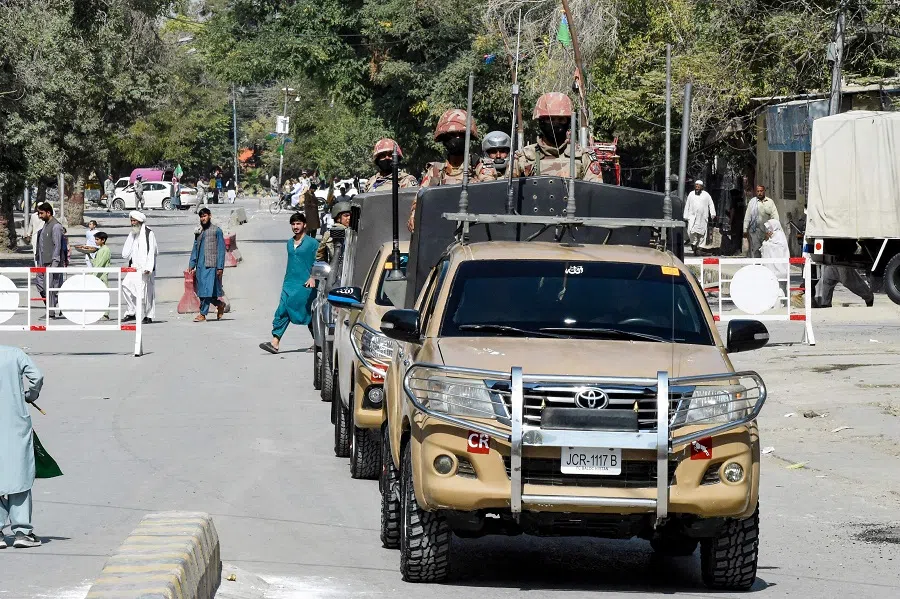 Security personnel patrol a street during a procession by Muslim devotees celebrating Eid-e-Milad-un-Nabi, the birthday of Prophet Mohammed, in Quetta on 17 September 2024. (Banaras Khan/AFP)
