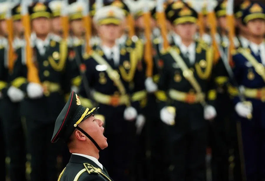 A Chinese People's Liberation Army honour guard shouts during a welcoming ceremony at the Great Hall of the People in Beijing, China, on 25 November 2025. (Maxim Shemetov/Reuters)