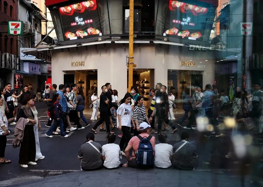 People walk in the shopping district of Ximending in Taipei, Taiwan, 19 April 2026. (Edgar Su/Reuters)