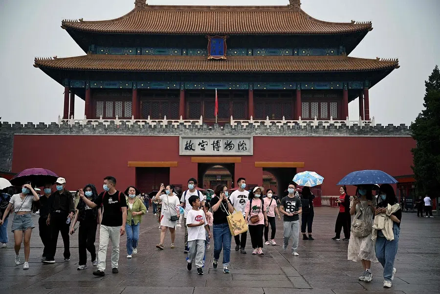 People walk from an exit gate of the Forbidden City in Beijing, China, on 1 October 2022. (Noel Celis/AFP)