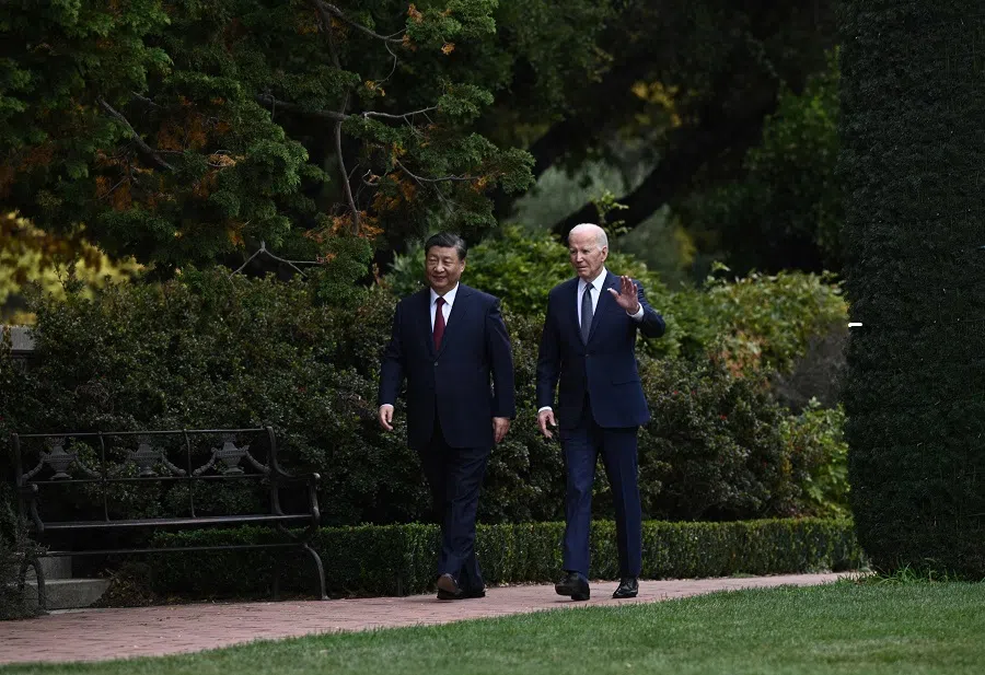 US President Joe Biden (and Chinese President Xi Jinping walk together after a meeting during the Asia-Pacific Economic Cooperation (APEC) Leaders' week in Woodside, California, on 15 November 2023. (Brendan Smialowski/AFP)