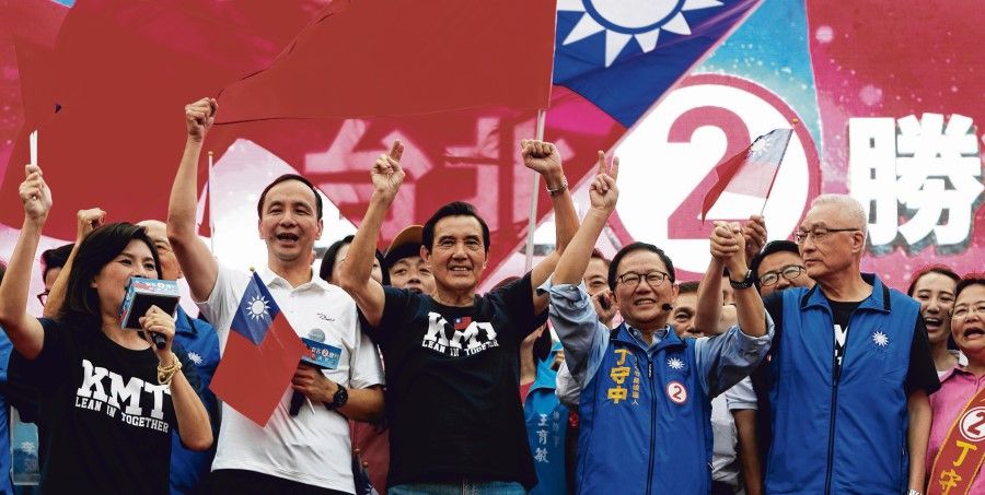 Current KMT chairman Eric Chu (second from left) with former President Ma Ying-jeou (third from left) and other KMT members at a campaign rally for the local elections, in Taipei, Taiwan, 11 November 2018. (Tyrone Siu/Reuters)
