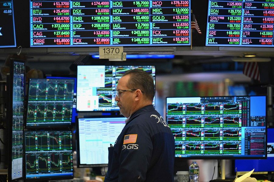 A trader on the floor of the New York Stock Exchange, 4 March 2024, in New York City. (Angela Weiss/AFP)