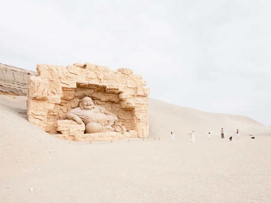 A Maitreya (弥勒佛) statue in the desert.