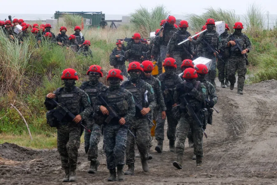 Taiwanese soldiers march during the annual Han Kuang anti-landing drill in New Taipei City, Taiwan, on 27 July 2023. (Ann Wang/Reuters)