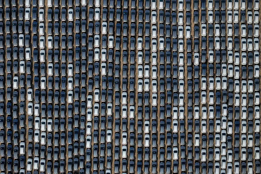 This photo taken on 18 April 2024 shows BYD electric cars for export waiting to be loaded onto a ship at a port in Yantai, in eastern China’s Shandong province. (AFP)
