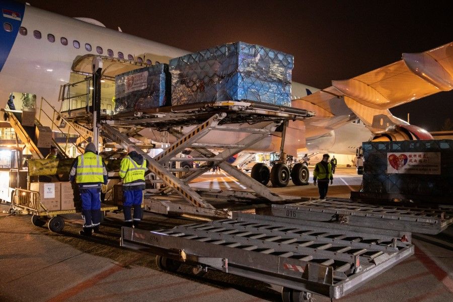 Employees at the Nikola Tesla airport, Serbia, unload medical supplies sent from China, March 21, 2020. (Marko Djurica/REUTERS)