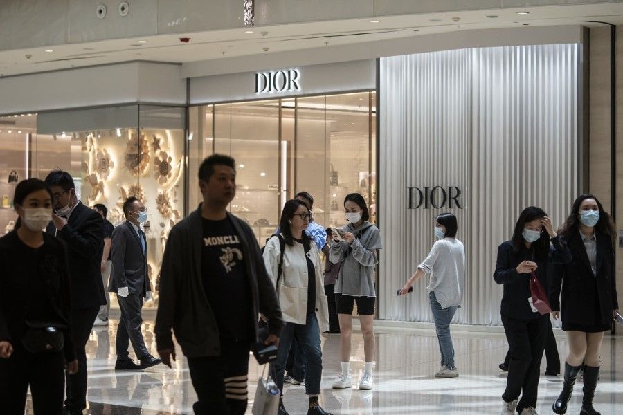 Visitors walk past a Christian Dior SE store in Shanghai, China, on 29 April 2023. (Qilai Shen/Bloomberg)