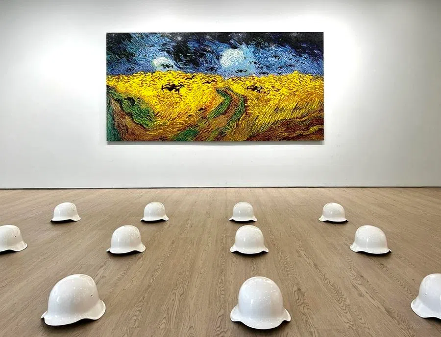 Helmets, drones, stretchers and other symbols of war take centre stage in Ai Weiwei's solo show at Tang Contemporary Art gallery in Singapore, which include his reimagination of Vincent van Gogh’s painting, where Ai replaces the black crows with drones. The show ran from 21 March to 2 May 2026.