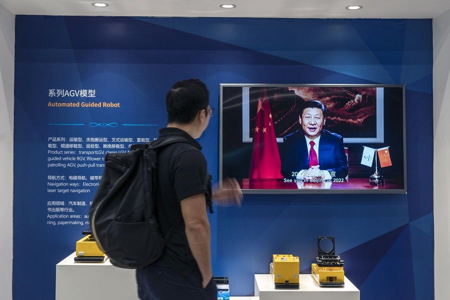 A screen showing a video of Chinese President Xi Jinping in an exhibition area at the Siasun Co. facility in the Lingang Special Area in Shanghai, China, on 25 August 2022. (Qilai Shen/Bloomberg)