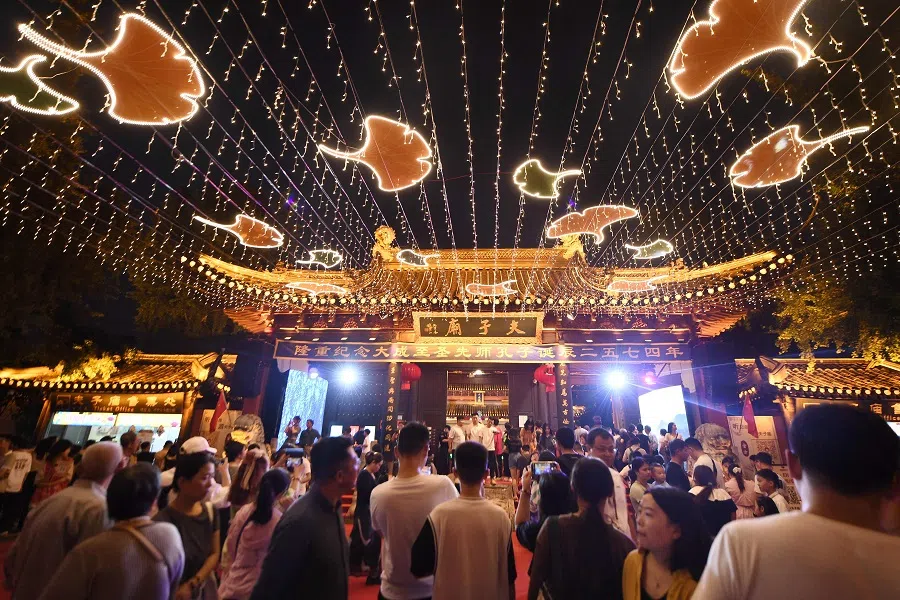 In this photo taken on 29 September 2023, people visit the Confucius Temple Scenic Area in Nanjing, Jiangsu province, China. (AFP)