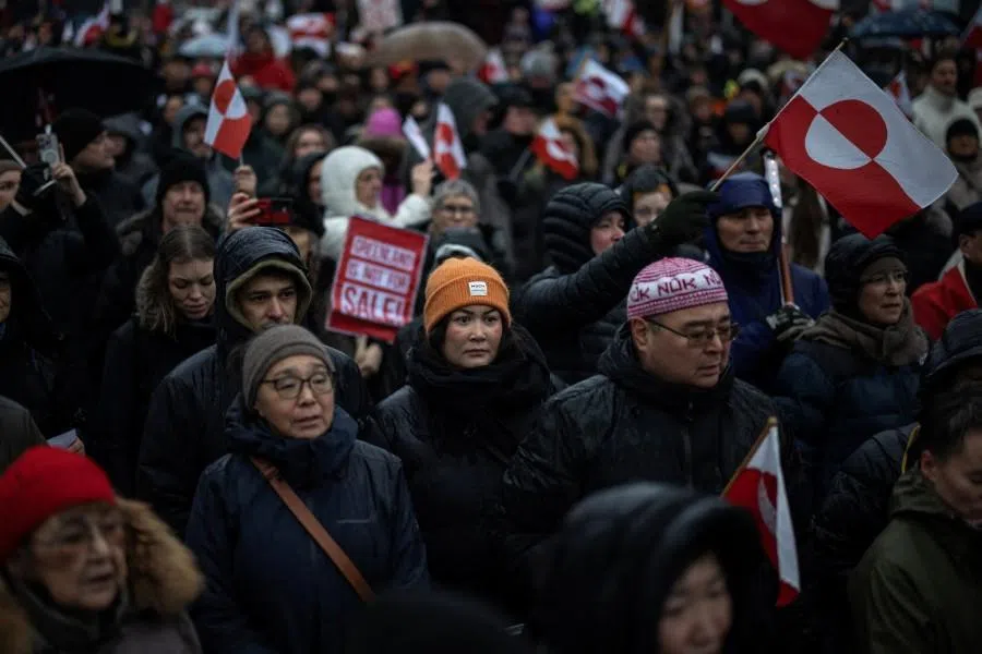 People attend a protest against US President Donald Trump’s demand that the Arctic island be ceded to the US, calling for it to be allowed to determine its own future, in Nuuk, Greenland, on 17 January 2026. (Marko Djurica/Reuters)