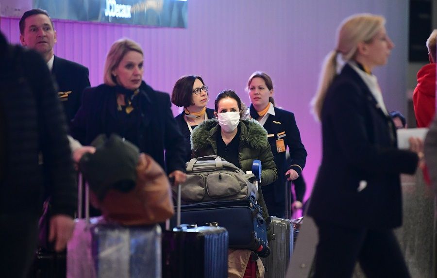 International travellers arrive at Los Angeles International Airport on 12 March 2020, one day before a US flight travel ban hits 26 European countries amid ongoing precautions over the Covid-19 coronavirus. (Frederic J. Brown/AFP)