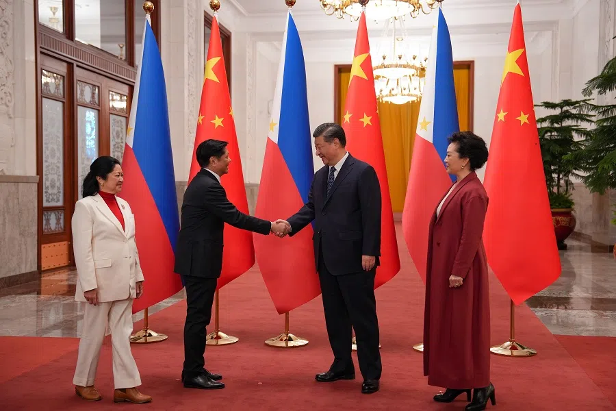 Philippine President Ferdinand Marcos Jr and Chinese President Xi Jinping shake hands as their respective wives, First Lady Louise Araneta-Marcos and Ms. Peng Liyuan, watch them at the Great Hall of the People in Beijing, China, on 4 January 2023. (Office of the Press Secretary)