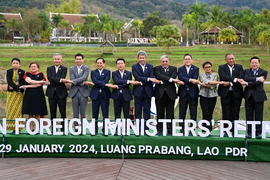 Myanmar Permanent Secretary Marlar Than Htike (first left) along with other ASEAN representatives and the ASEAN secretary-general pose for a group photo during the ASEAN Foreign Ministers' meeting in Luang Prabang on 29 January 2024. (Tang Chhin Sothy/AFP)