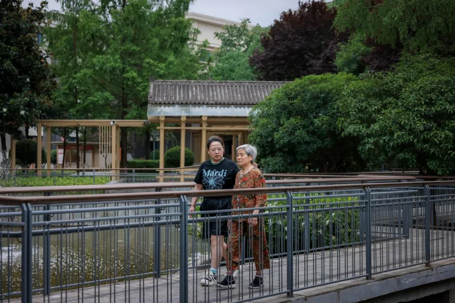 Wang Ya Fei (right) and her daughter-in-law Lü Jing at the Perennial Alzheimer’s Care Village in Xi’an on 4 June 2025. (SPH Media)