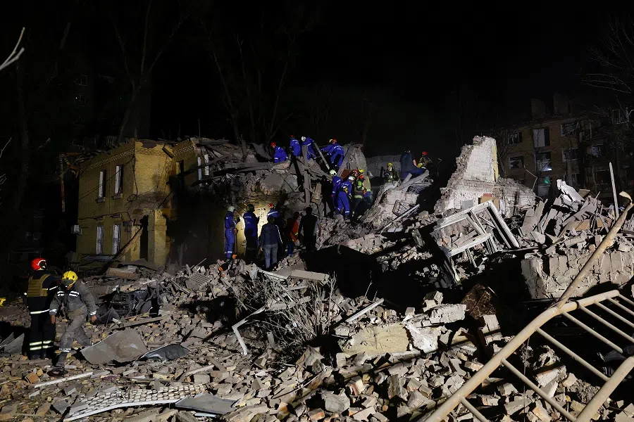 Rescuers work at the site of an apartment building hit by a Russian ballistic missile strike, amid Russia’s attack on Ukraine, in Kyiv, Ukraine, on 24 April 2025. (Valentyn Ogirenko/Reuters)