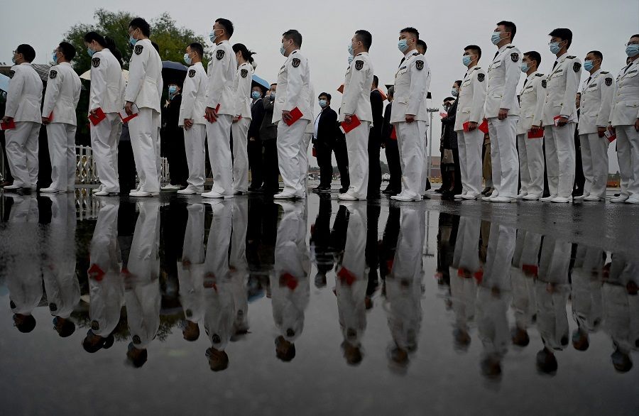 Military delegates arrive for the commemoration of the 110th anniversary of the Xinhai Revolution at the Great Hall of the People in Beijing, China, on 9 October 2021. (Noel Celis/AFP)