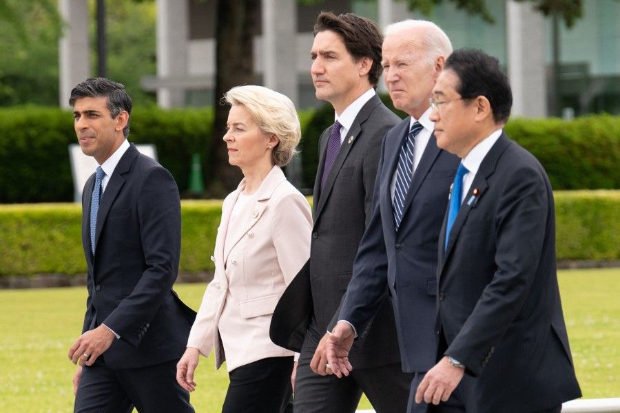 (Left to right) UK Prime Minister Rishi Sunak, European Commission President Ursula von der Leyen, Canada's Prime Minister Justin Trudeau, US President Joe Biden and Japan's Prime Minister Fumio Kishida visit the Peace Memorial Park as part of the G7 Leaders' Summit in Hiroshima on 19 May 2023. (Stefan Rousseau/AFP)