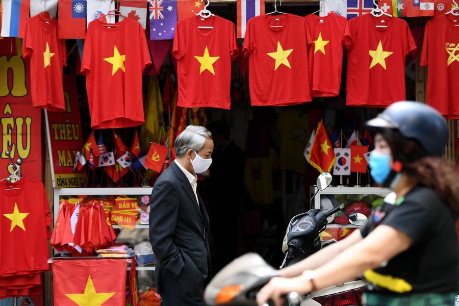 In 2018, 4,966,500 Chinese tourists visited Vietnam, accounting for 32% of Vietnam's foreign tourist arrivals in the same year. In this photo, a man wearing a protective face mask walks past a souvenir shop in Hanoi on 26 February 2020, amid concerns of the Covid-19 coronavirus outbreak. (Nhac Nguyen/AFP)