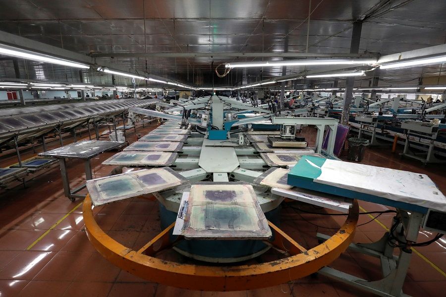 An empty printing assembly is seen at a partially closed industrial printing factory during the Covid-19 outbreak in Hung Yen province, Vietnam, on 7 April 2020. (Kham/Reuters)