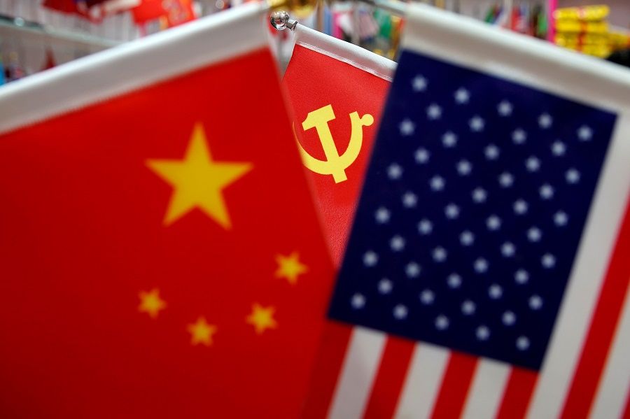 The flags of China, the United States and Chinese Communist Party are displayed in a flag stall at the Yiwu Wholesale Market in Yiwu, Zhejiang province, China, 10 May 2019. (Aly Song/File Photo/Reuters)
