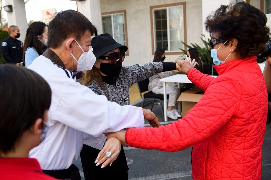 People practice self-defence techniques during a training class in response to hate and violence against Vietnamese and Asian American Pacific Islander (AAPI) people at Advance Beauty College on 23 March 2021 in Garden Grove, California, US. (Patrick T. Fallon/AFP