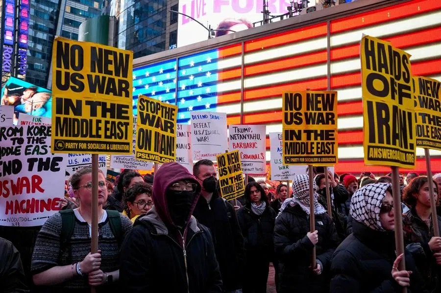 People take part in a protest in Times Square against the US-Israeli conflict with Iran, and against conflict in Lebanon and Gaza, in New York City, US, on 8 April 2026. (Adam Gray/Reuters)