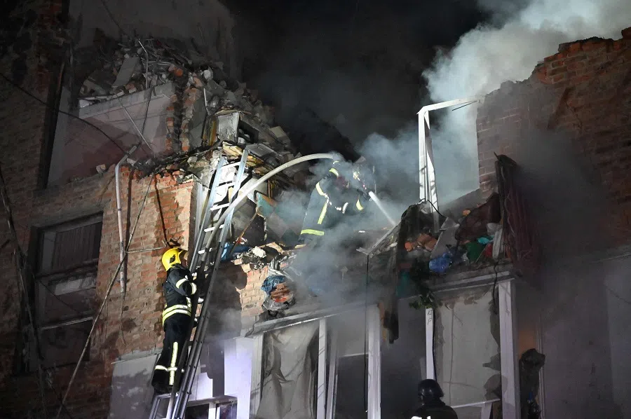 Rescuers extinguish a fire in an apartment building destroyed by a Russian missile attack in Kharkiv early on 31 May 2024, amid the Russian invasion in Ukraine. (Sergey Bobok/AFP)