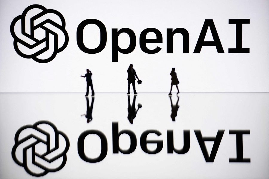 This illustration photograph taken on 30 October 2023, in Mulhouse, eastern France, shows figurines next to a screen displaying a logo of OpenAI, a US artificial intelligence organisation. (Sebastien Bozon/AFP)