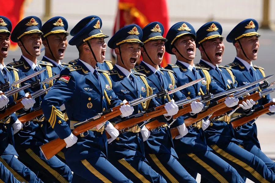 Chinese honour guards march during a ceremonial welcome at the Great Hall of the People in Beijing on 24 April 2025. (Iori Sagisawa/Pool/AFP)