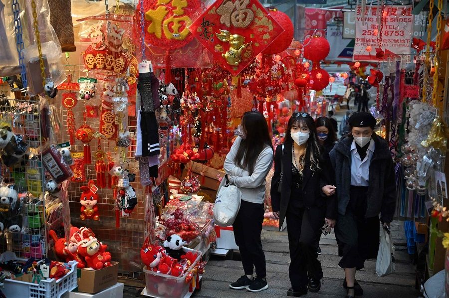 People buy Lunar New Year decorations in Hong Kong, China, on 9 January 2023 for the upcoming Year of the Rabbit. (Peter Parks/AFP)