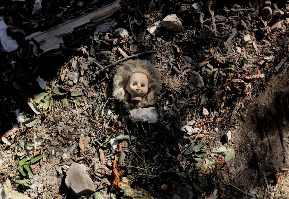 A vintage doll is pictured near a damaged kindergarten following recent Russian shelling in the city of Slovyansk, Ukraine, as Russia's attack in Ukraine continues, on 2 September 2022 (Ammar Awad/Reuters)