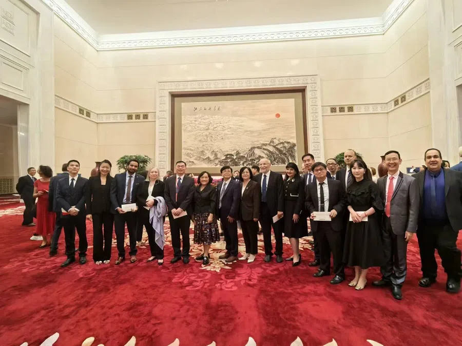 Samuel Gan (front row, fourth from right, in black tie) representing Wenzhou-Kean University at a dinner banquet organised by Ding Xuexiang, vice premier of China and member of the Communist Party of China Politburo Standing Committee, at the Great Hall of the People. (Photo provided by interviewee)