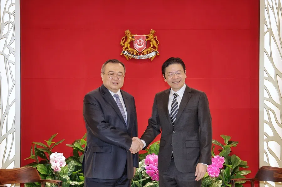 Communist Party of China International Department (CPCID) Minister Liu Jianchao and Deputy Prime Minister Lawrence Wong shaking hands during a courtesy call at The Treasury on 26 March 2024. Liu was in town to attend the FutureChina Dialogue held in Singapore this March. (Kevin Lim/SPH Media)