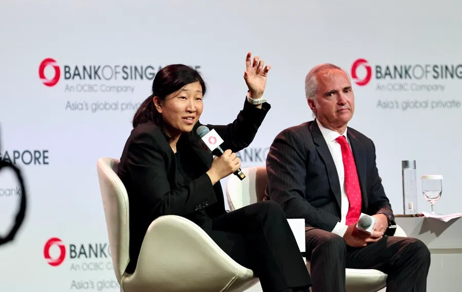Jenny Lee (L) speaking during the Bank of Singapore Year 2024: Fast Forward to the Future event, and sitting next to Steve Okun, founder and CEO of APAC Advisors, 11 January 2024. (SPH Media)