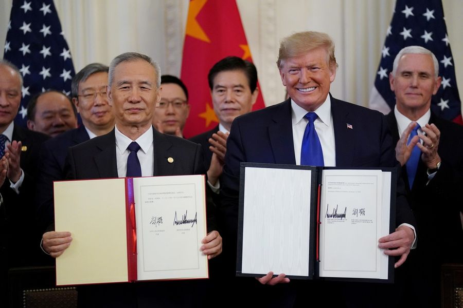 US President Donald Trump and Chinese Vice Premier Liu He signs phase one of the US-China trade agreement in the East Room of the White House in Washington on 15 January 2020. (Kevin Lamarque/Reuters)