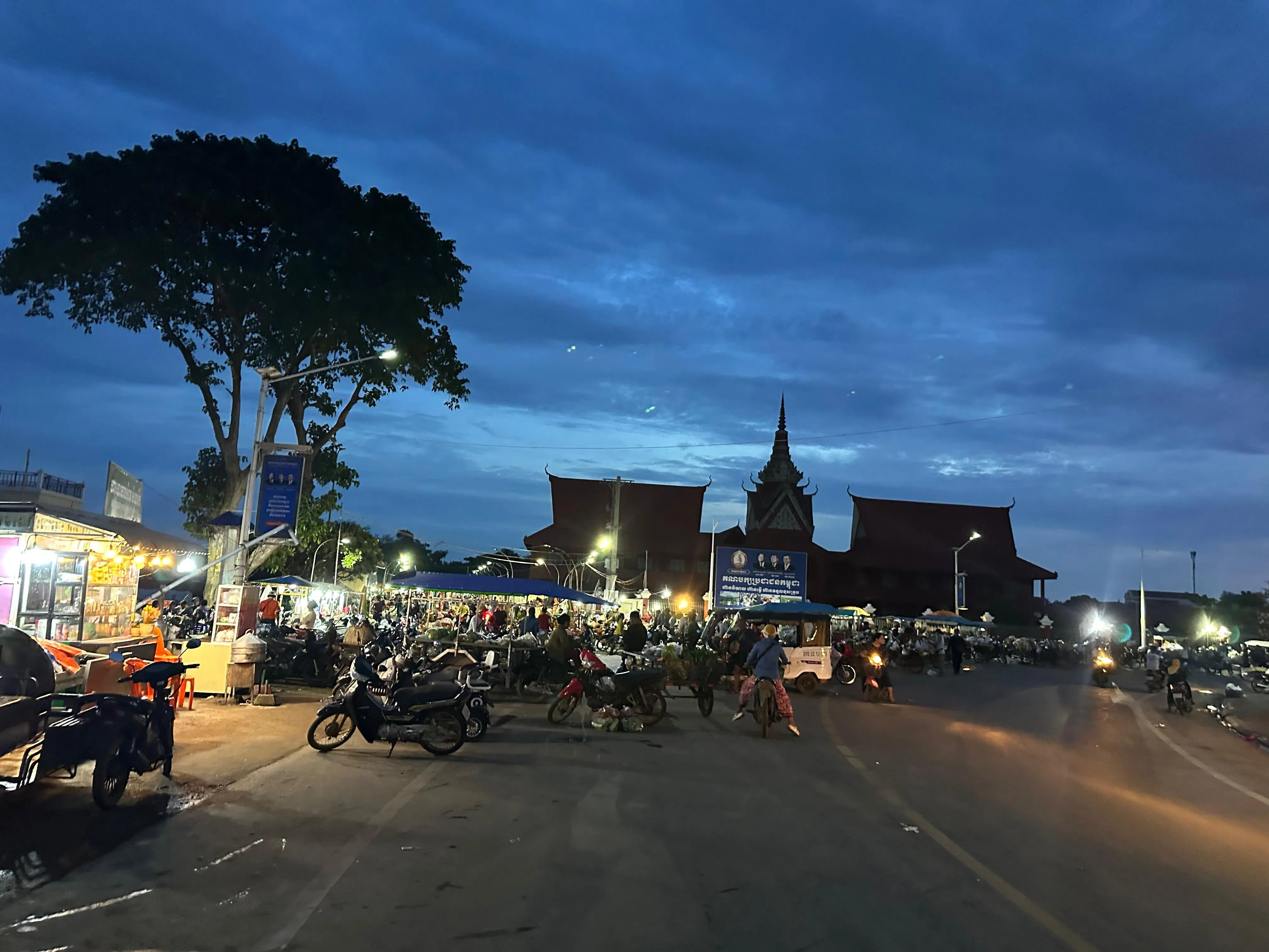 Traders and shoppers at a busy market in Kratie province, Cambodia, around 5 am.