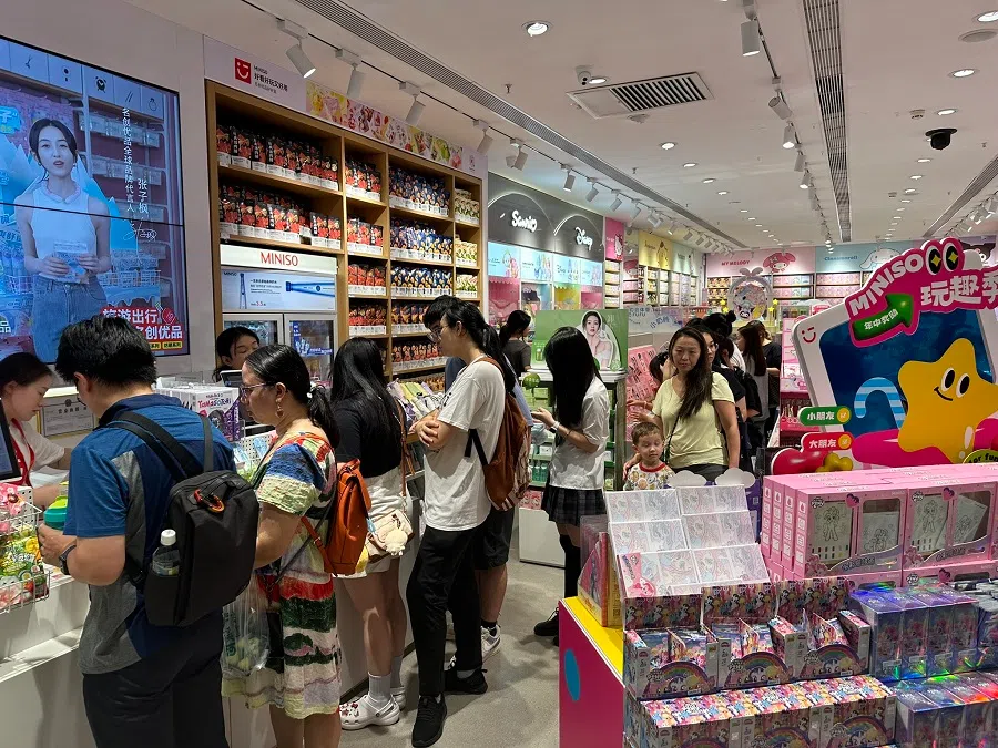 Customers queueing up in a Miniso store. 