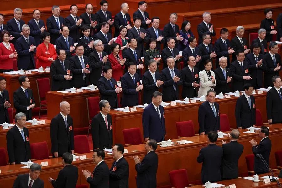 Delegates applaud as Chinese President Xi Jinping and other Politburo members arrive for the second plenary session of the National People's Congress (NPC) at the Great Hall of the People in Beijing, China, on 9 March 2026. (Florence Lo/Reuters)