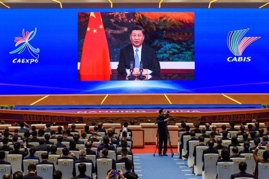 This file photo taken on 27 November 2020 shows Chinese President Xi Jinping delivering a speech via video at the opening ceremony of the 17th China-ASEAN (Association of Southeast Asian Nations) Expo in Nanning, in southern China's Guangxi province. (STR/AFP)